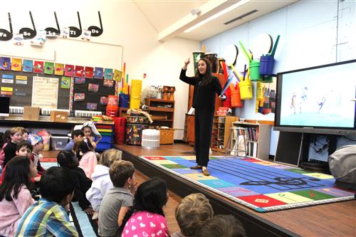 Woman reads to children