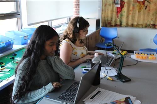 Girls working at laptop